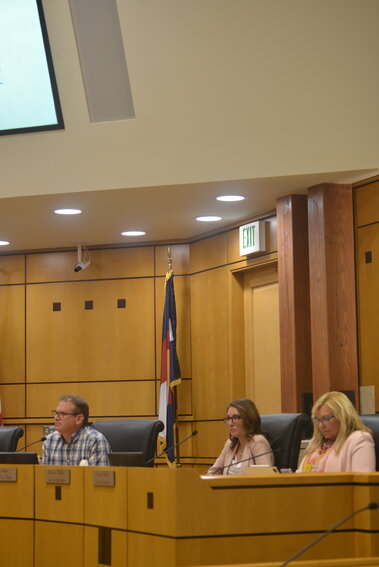 (L to R): Councilmembers John Diak, Brandi Wilks and Laura Hefta listening to a presentation during a town council meeting.